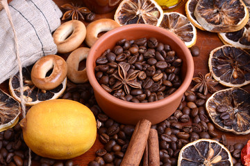 Obraz na płótnie Canvas coffee beans and candle. lemon and cinnamon. anise and aroma spice