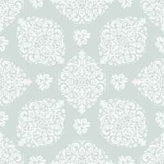 Seamless oriental ornament in the style of baroque. Traditional classic vector light blue and white pattern