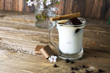 Mug of ice coffee with milk