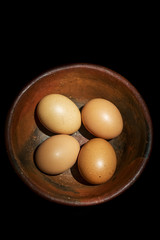 four eggs in a bowl