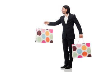 Black suit man holding plastic bags isolated on white