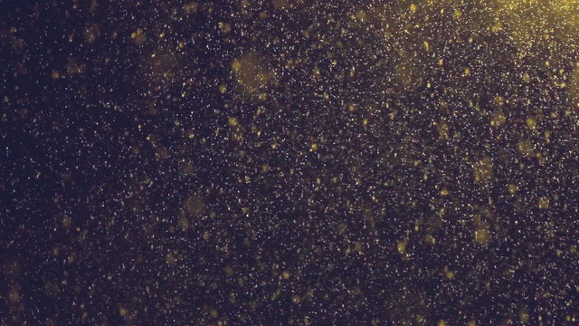 Snow falls small flakes in dark with illumination