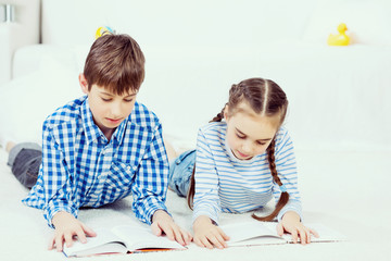 Cute kids reading books