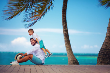 happy father and son playing together near the seaside © Olesia Bilkei