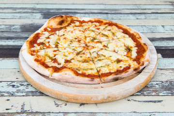 Pizza Margarita on wood background