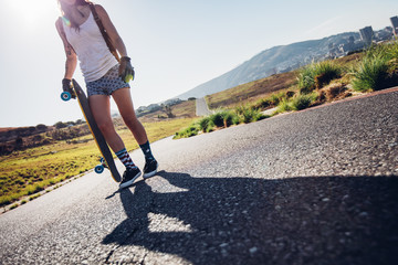 Woman ready to go longboarding