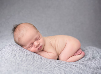 Newborn Baby Sleeping on Blanket