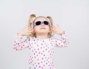 Little fashion girl in sunglasses