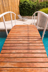 Bridge over the swimming pool in resort