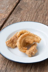 Pork rinds also known as chicharon or chicharrones, deep fried p
