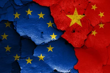 Fotobehang flags of EU and China painted on cracked wall © daniel0