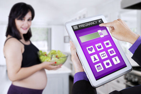 Pregnancy app with pregnant woman holds salad