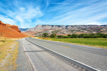 Highway passing through a colorful landscape in Shell, Wyoming