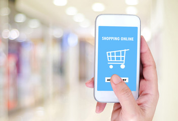 Hand  holding smart phone with shopping on line on screen