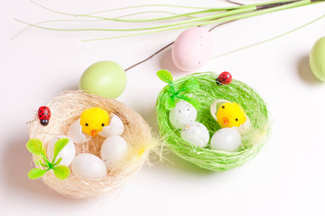 Easter chickens closeup and eggs in white desk