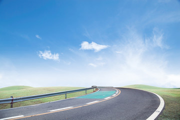 Fototapeta premium Roads and green grass Sky background.