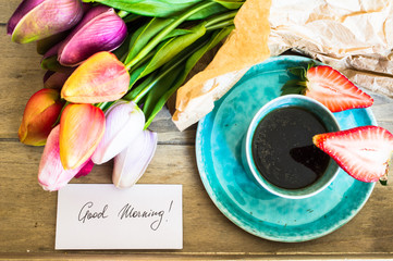 Tulips, coffee and fresh strawberries