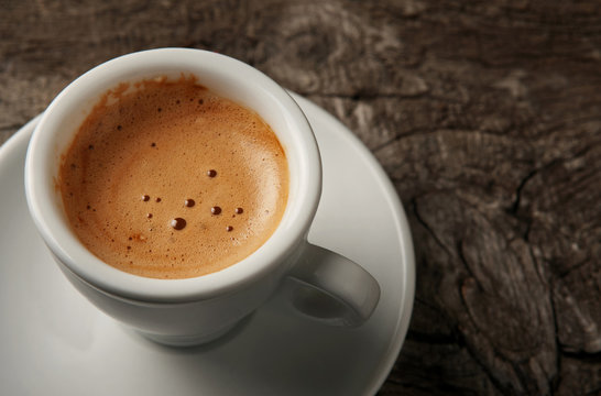 Fototapeta Closeup cup of coffee espresso with foam
