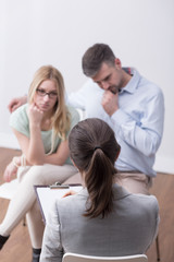 Psychologist helping couple