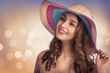 Young beautiful woman with a hat