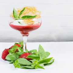 closeup of ice cream with fresh strawberries and mint in winegla