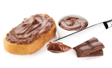 Table knife with chocolate butter. Macro.