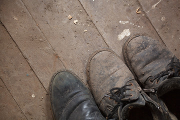 Old  shoes on wooden floor.