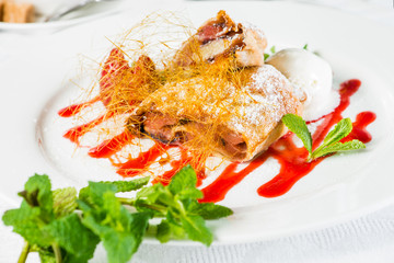 Apple Strudel Served with Ice Cream and Fresh Mint