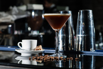 Fresh coffee cocktail with coffee beans and espresso at the bar