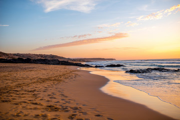 Beautiful sand beach near El Cotillo village on Fuerteventura island on the sunset in Spain