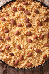  Italian almond cake Sbrisolona close up in baking dish. vertical top view
