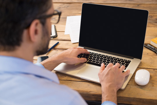 Man working on laptop - Powered by Adobe