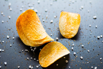 potato chips on a dark background