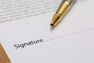 contract paper with pen