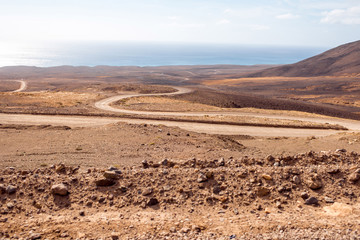 Deserted landscape with ground road on Jandia peninsula on Fuerteventura island in Spain