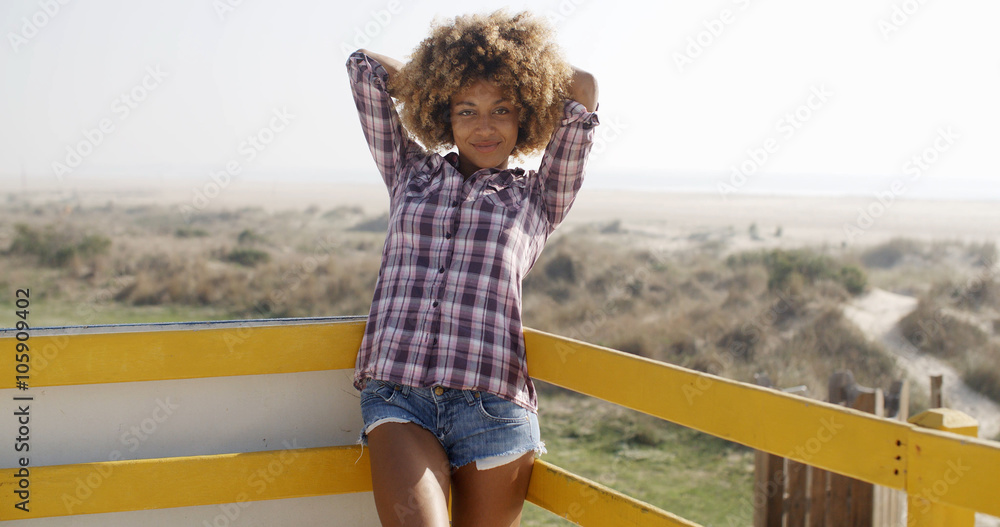 Wall mural Happy carefree freedom girl stands on balcony.