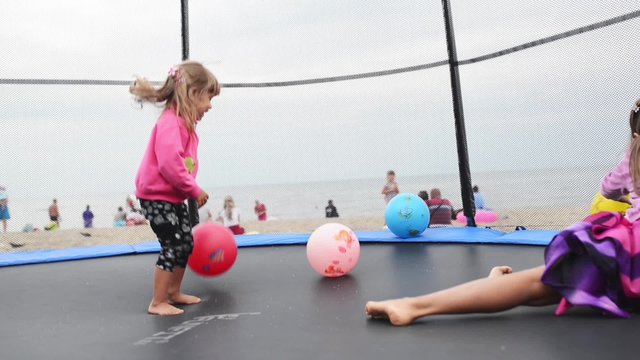 Baby girls at trampoline