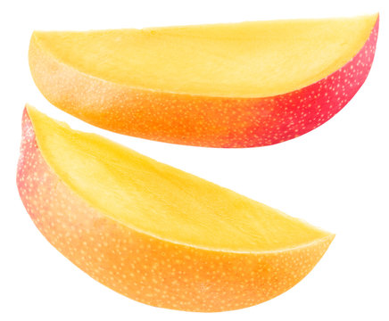 Slices of mango fruit over white. File contains clipping paths.