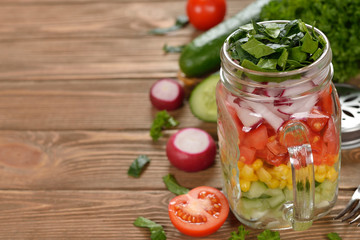 Fresh vegetable salad in Mason jar