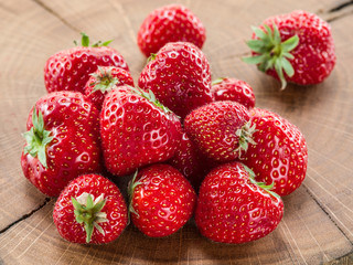 Strawberries on the old wooden board.