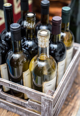 Wine bottles in a wooden crate .