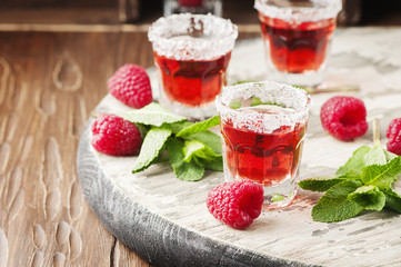 Red sweet cocktail with rapsberry and mint