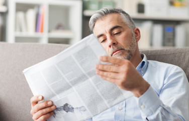 Businessman reading a newspaper