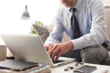 Businessman working with his laptop