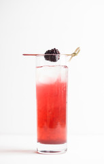 Blackberry cocktail on the wooden background