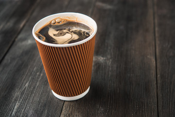 paper cup of hot coffee
