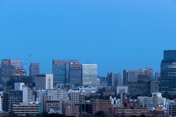 Fototapeta na wymiar 東京都市風景　大手町　丸の内　ビル群　トワイライト　夜景　コピースペース