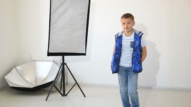 Photographer taking pictures of the child in the studio.