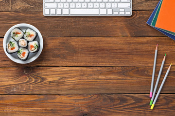 Top View of Vintage wooden Table with Computer and Food