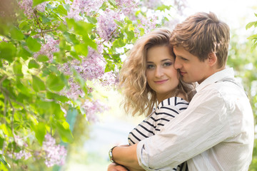 Fototapeta premium young couple near lilac tree